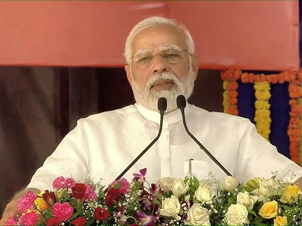 PM Narendra Modi addresses a gathering after inaugurating a 200-bed multi-specialty hospital at Atkot town in Gujarat
